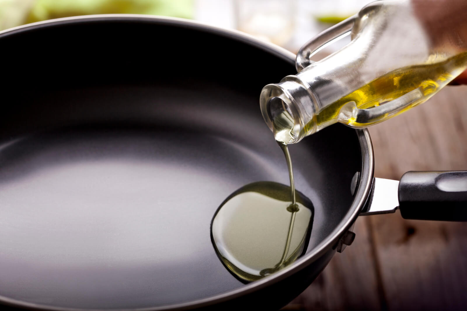 Pouring oil in frying pan