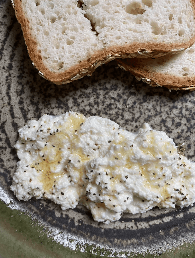 Fresh ricotta cheese with honey and sourdough bread