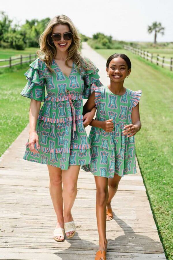 A mother and daughter walking.
