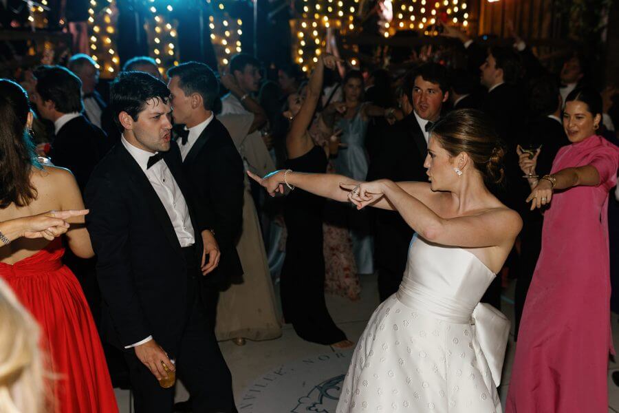 A North Carolina Wedding Dressed in Blues, Bows, and Bojangles - 22 A bride and groom dancing at a reception.