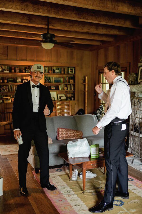 A North Carolina Wedding Dressed in Blues, Bows, and Bojangles - 11 Two men in tuxedos standing in a living room.
