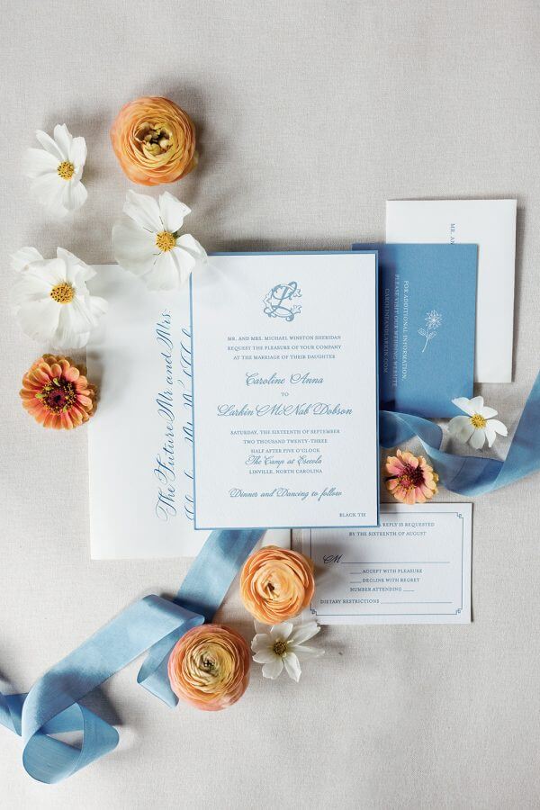 A North Carolina Wedding Dressed in Blues, Bows, and Bojangles - 5 Blue and white Linville Wedding invitations with flowers.
