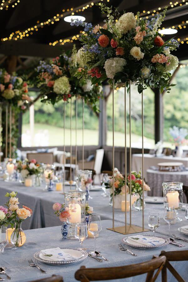A North Carolina Wedding Dressed in Blues, Bows, and Bojangles - 6 A table is set up with candles and flowers.