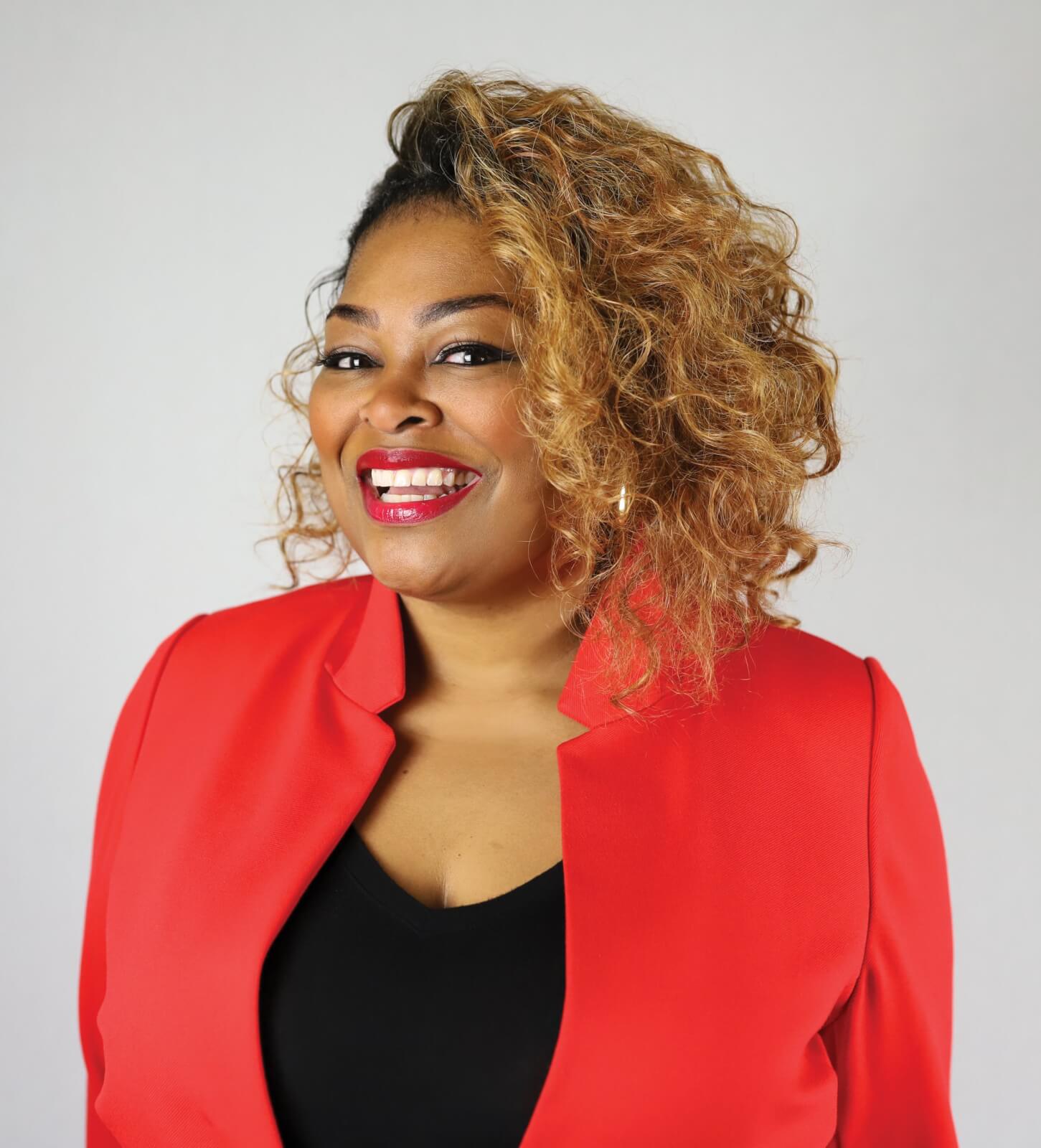 A woman in a red jacket.