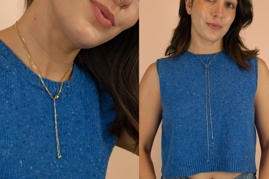 Woman in a blue shirt wearing a gold bolo style necklace