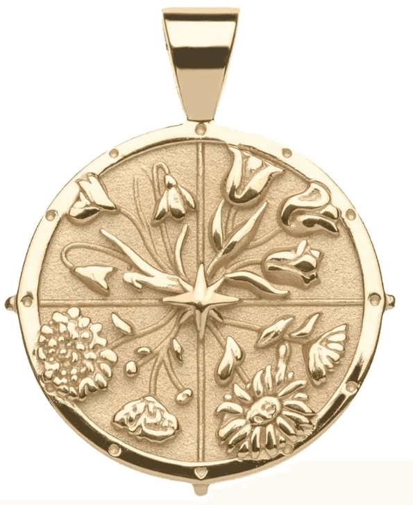 Gold pendant featuring a circular design with embossed floral motifs 
