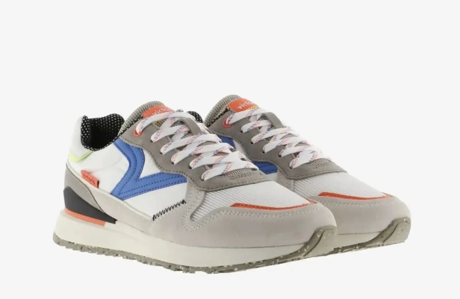 A pair of gray athletic shoes with colorful accents, white laces, and a textured sole makes for an excellent choice in expensive gift ideas.