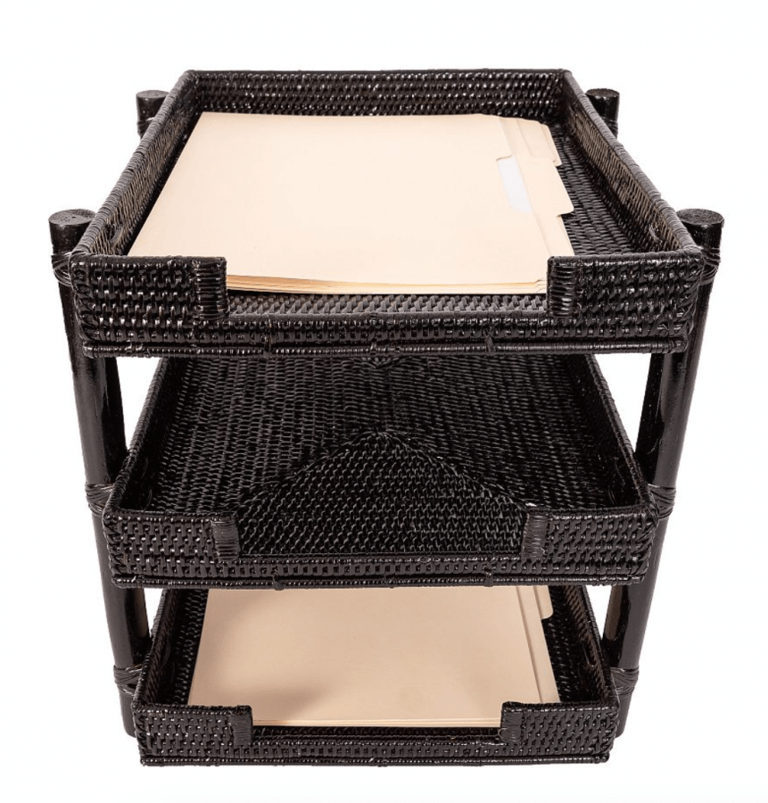 A three-tier black rattan paper tray containing beige file folders on the top two shelves.