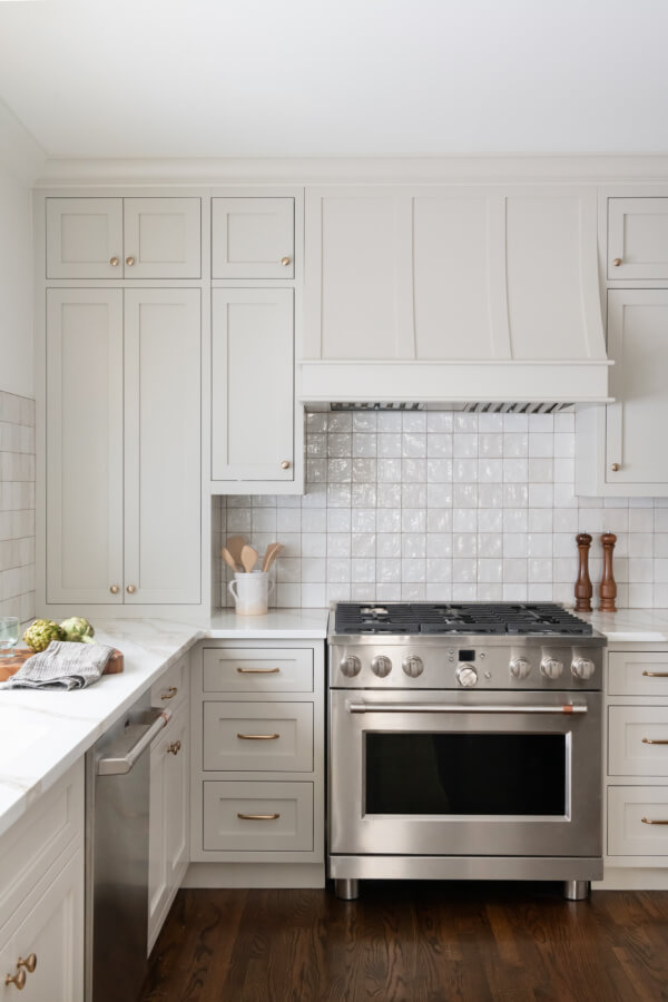 White kitchen with stainless stove