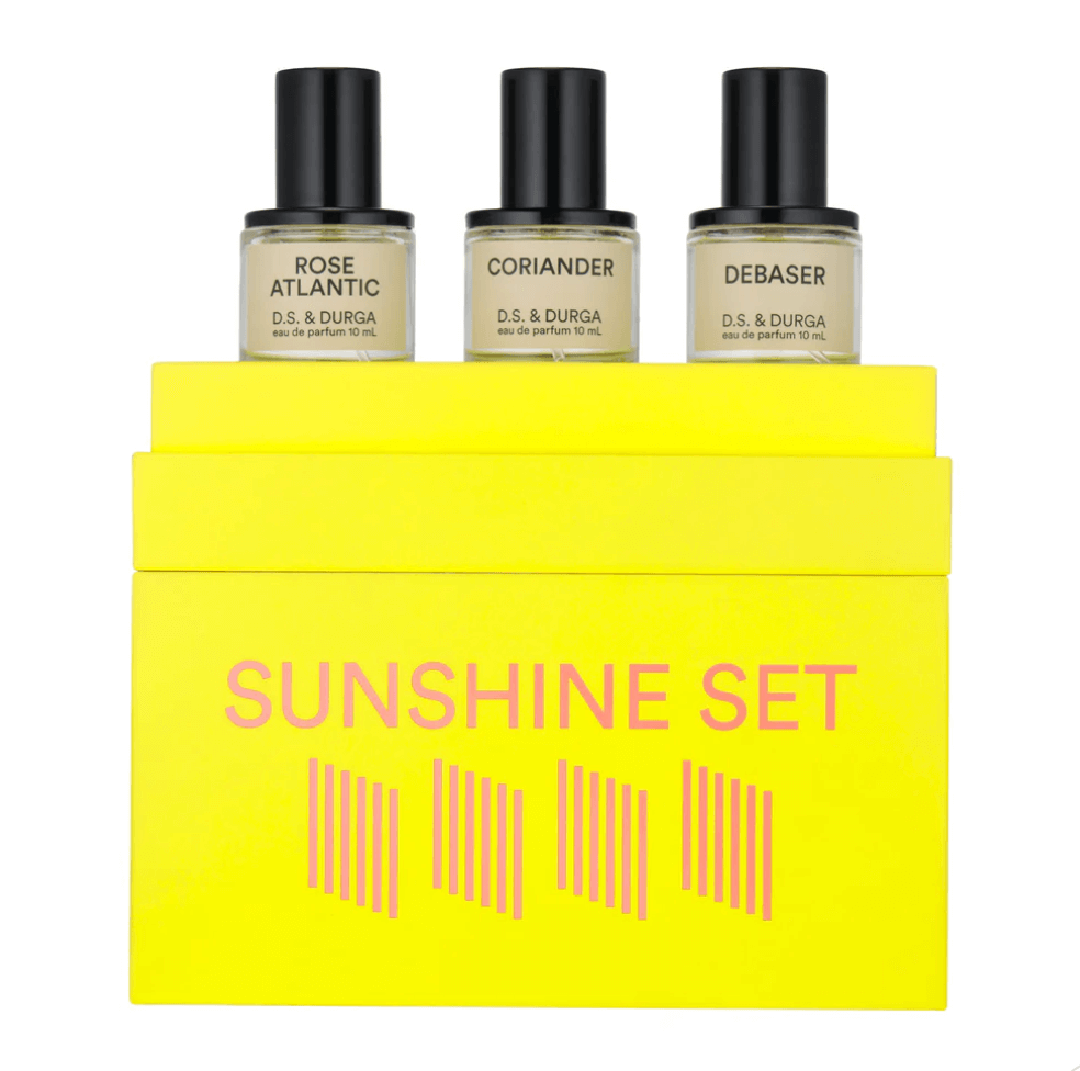 17 Birmingham FINDS Perfect for Summer - 10 A set of three D.S. & Durga eau de parfum bottles labeled Rose Atlantic, Coriander, and Debaser, elegantly displayed above a yellow box with "Sunshine Set" written on it—your ultimate FINDS for Summer in Birmingham.