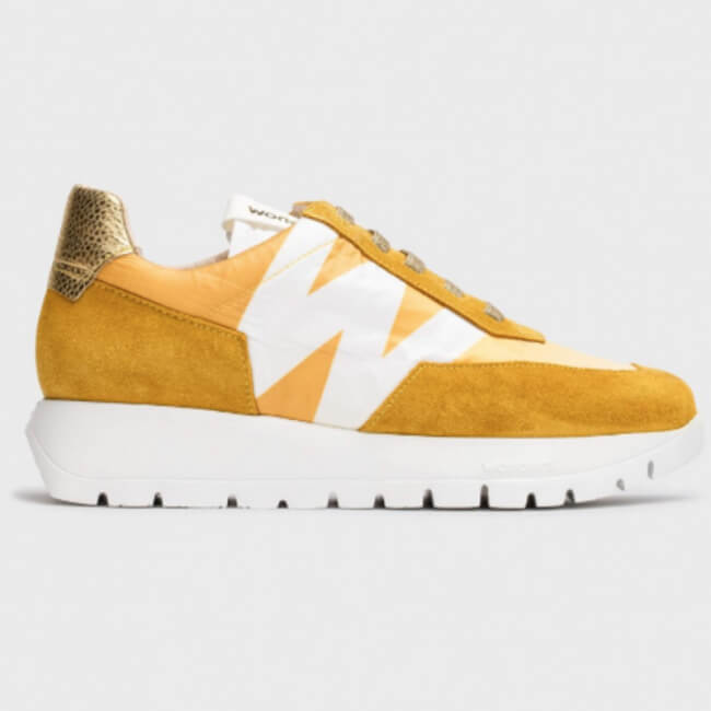 17 Birmingham FINDS Perfect for Summer - 2 A yellow and white sneaker with a white sole, featuring an angular design on the side and a golden heel patch.