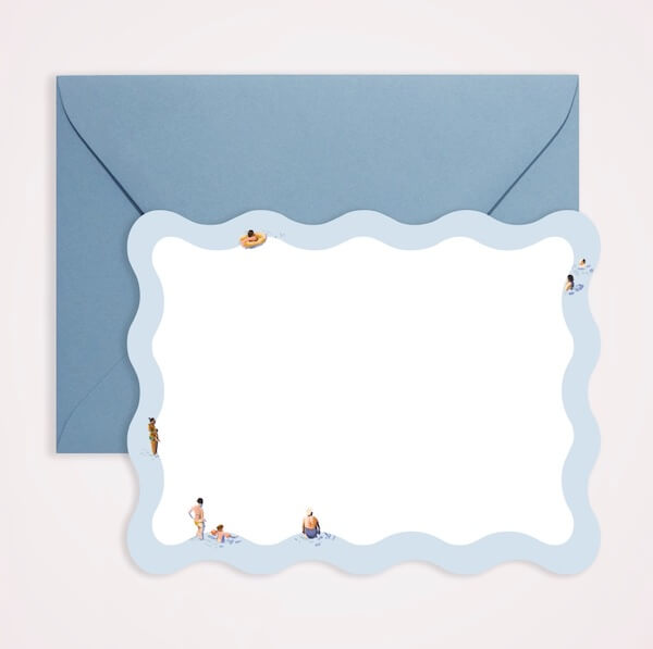 A blue envelope and a wavy-edged card featuring FINDS: small illustrations of people swimming and relaxing around the border. The card has a blank white center.