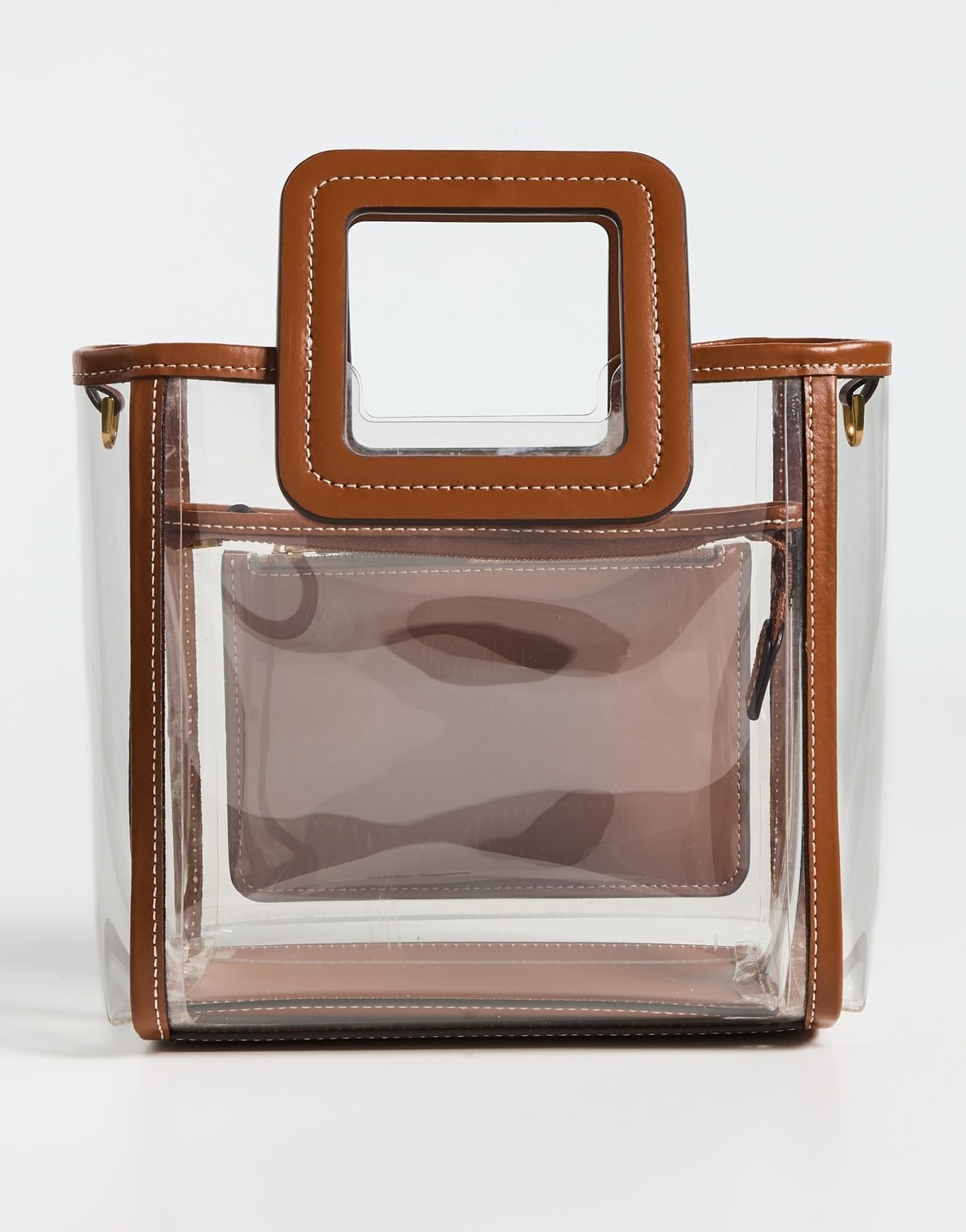 Clear rectangular tote bag with brown square handles, brown trim, and an inner zippered pouch—one of our elegant clear bags—shown against a white background.