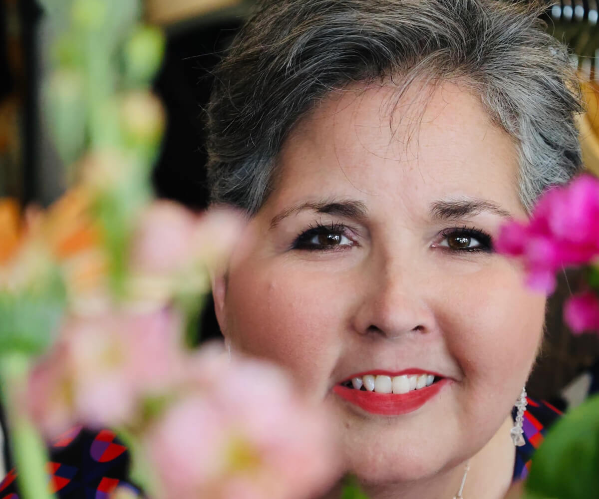 Stacey Pierce-Nickle close-up with flowers