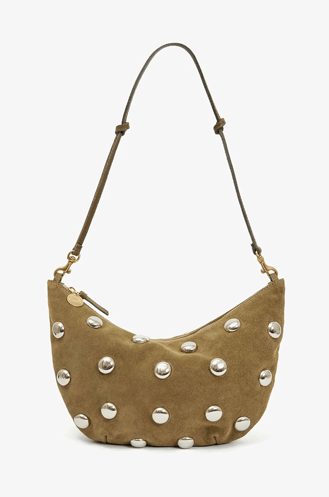 A brown suede shoulder bag with silver circular studs and an adjustable leather strap, perfect for October strolls.