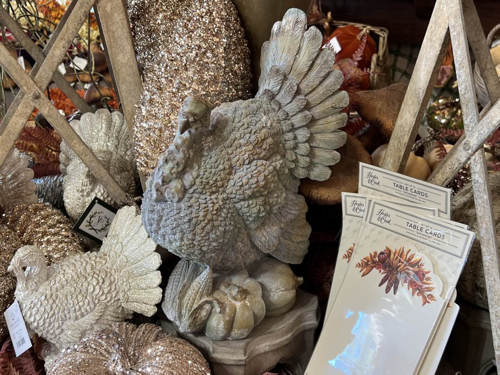 Decorative turkeys, pumpkins, and greeting cards featuring autumn-themed designs. 