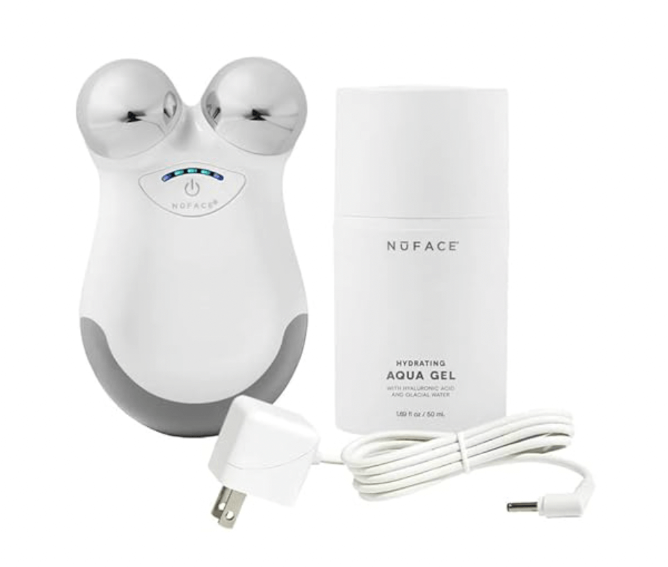 A NuFACE device with two metal spheres, a hydrating aqua gel bottle, and a power adapter with cord are displayed—an Amazon favorite among self-care gadgets for boosting your skincare routine.