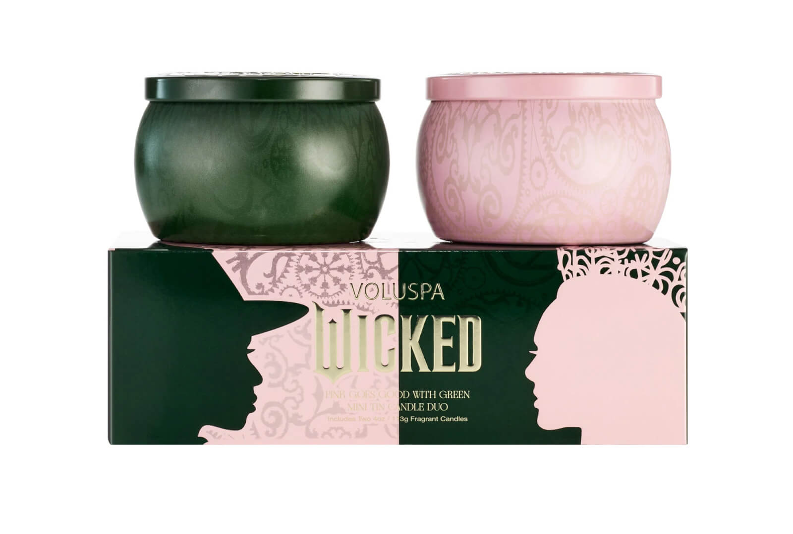 Two Voluspa candles in pink and green containers rest on a matching box, featuring a silhouette design with the word "Wicked"—a chic addition to the SB Hot List for January 2025.