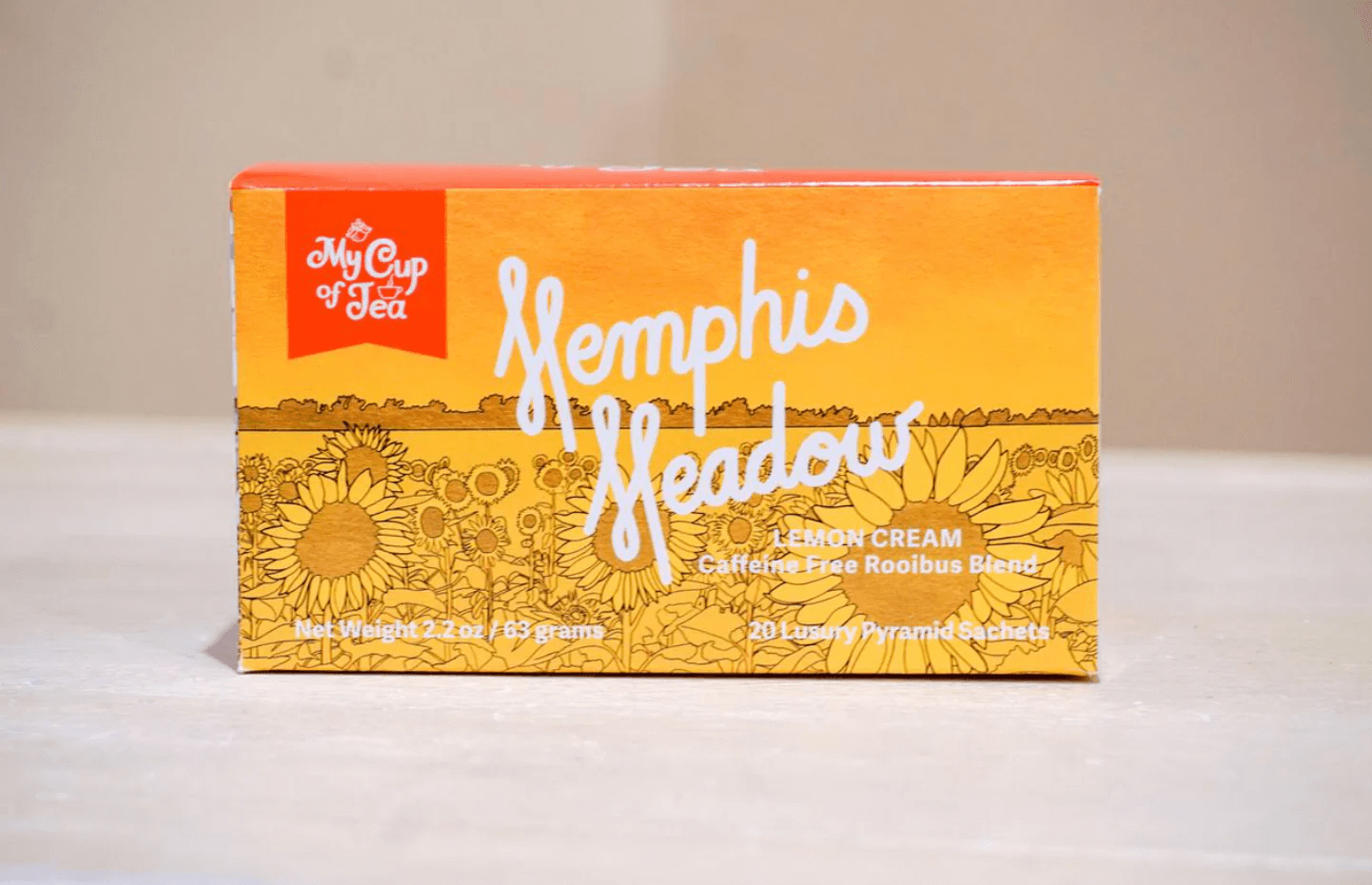 Discover the delightful "Memphis Meadow" lemon cream rooibos tea by "My Cup of Tea." This charming box, adorned with a lovely sunflower design, contains 20 sachets (net weight 2.2 oz or 63 grams) of caffeine-free bliss. It's one of February's best FINDS for tea lovers!.