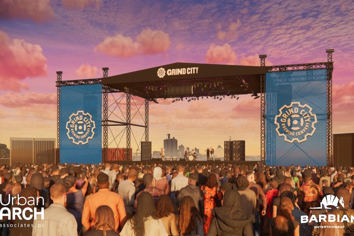 A large crowd faces an outdoor concert stage with "GRIND CITY" branding, under a colorful sunset sky. Event logos and the city skyline highlight the scene—an exciting experience that's new in Memphis.