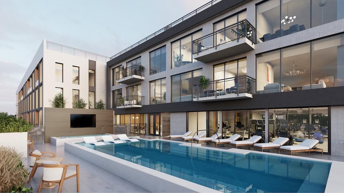 Experience luxury living at Athena at The Park, a modern apartment building in Nashville. Enjoy large windows and balconies, and unwind by the rooftop pool surrounded by lounge chairs and a cozy seating area.
