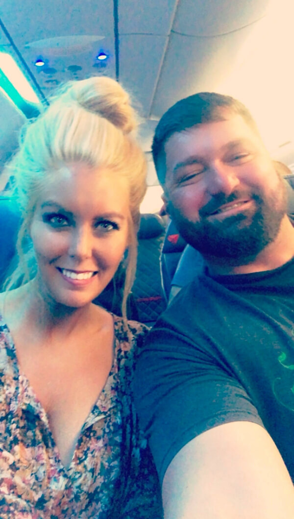 They Had the Last Pre-COVID Wedding in Vegas! - 2 Two people smiling and sitting side-by-side on an airplane.