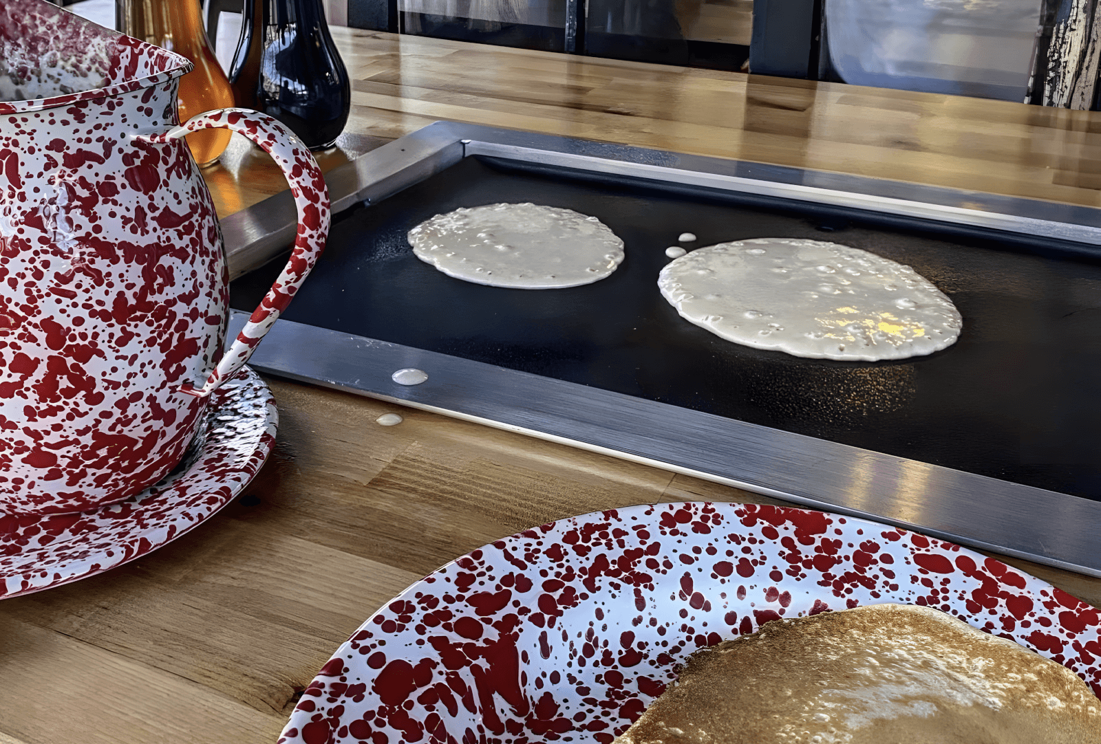 6 Southern Outdoor Getaways for the Adventure Traveler - 14 two circles of pancake batter on a griddle in the center of a table at Old Sugar Mill Pancake House.