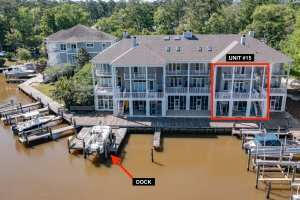 Located on Scenic Highway 98 in Fairhope AL, this waterfront condo building features docks; Unit 15 is highlighted on the second floor with a labeled dock shown directly in front of the unit.
