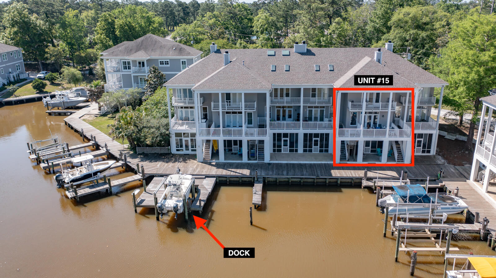 Located on Scenic Highway 98 in Fairhope AL, this waterfront condo building features docks; Unit 15 is highlighted on the second floor with a labeled dock shown directly in front of the unit.