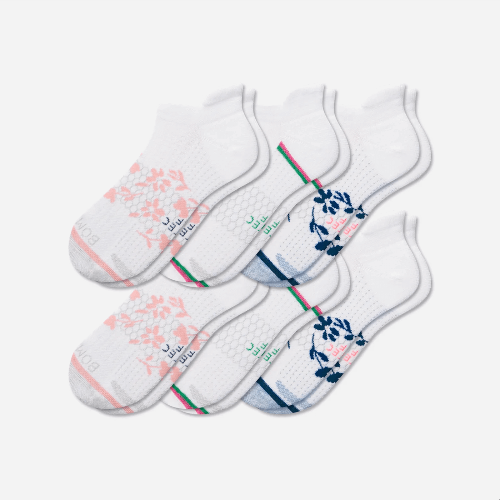 A set of six white ankle socks with different colored floral patterns and stripe accents—perfect for adding a playful touch to your golf attire or court outfit—arranged in two overlapping rows on a plain background.