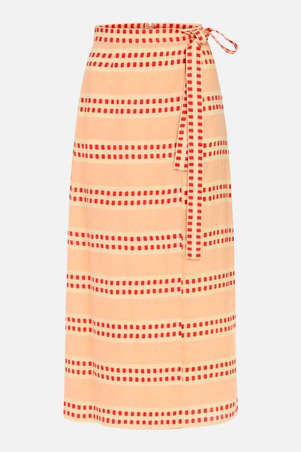 19 Fresh FINDS Around BHAM: Closet Refreshers, Entertaining Picks & More - 2 Beige wrap skirt with red square stripe pattern and waist tie, featured in Birmingham FINDS April edit, displayed on a plain white background.