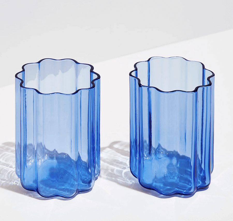 12 Colored Glass Accessories We Love: Cake Stands, Candlesticks & More - 11 Two blue scalloped-shaped glasses