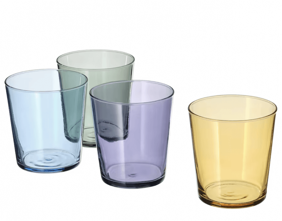 12 Colored Glass Accessories We Love: Cake Stands, Candlesticks & More - 9 These vibrant colored glass drinking cups in green, blue, purple, and yellow are a perfect addition to your spring wish list against a crisp white backdrop.