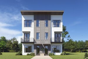 A modern three-story duplex with balconies, large windows, and a flat roof, set amid grass and trees under a clear blue Nashville sky.