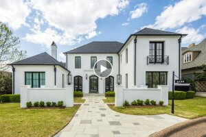 Two-story modern white house with black window frames, manicured lawn, stone walkway, and a black address sign reading "6155" in the front yard on 6155 Chepelle Cir. W., Memphis, TN.