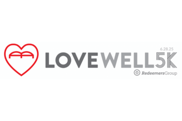 Logo for the LOVEWELL 5K race on June 28, 2025, presented by Redeemers Group, featuring a red heart symbol and gray text. Part of the Love Well Festival celebration.