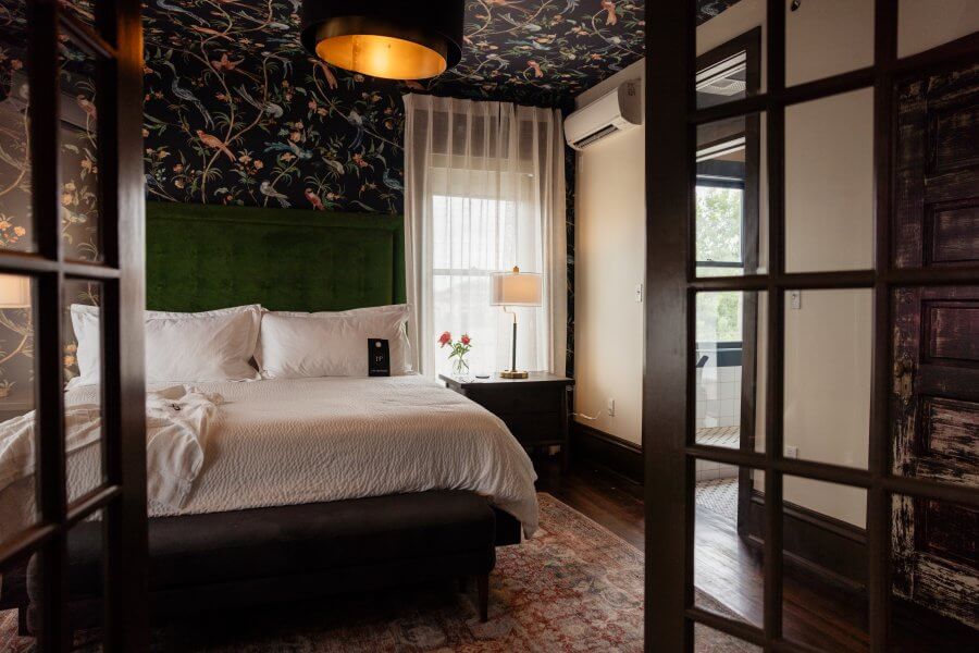 Memphis’s 10 Most Popular Articles of 2025 - 10 Interior of a hotel room at Hotel Pontotoc, featuring floral wallpaper.