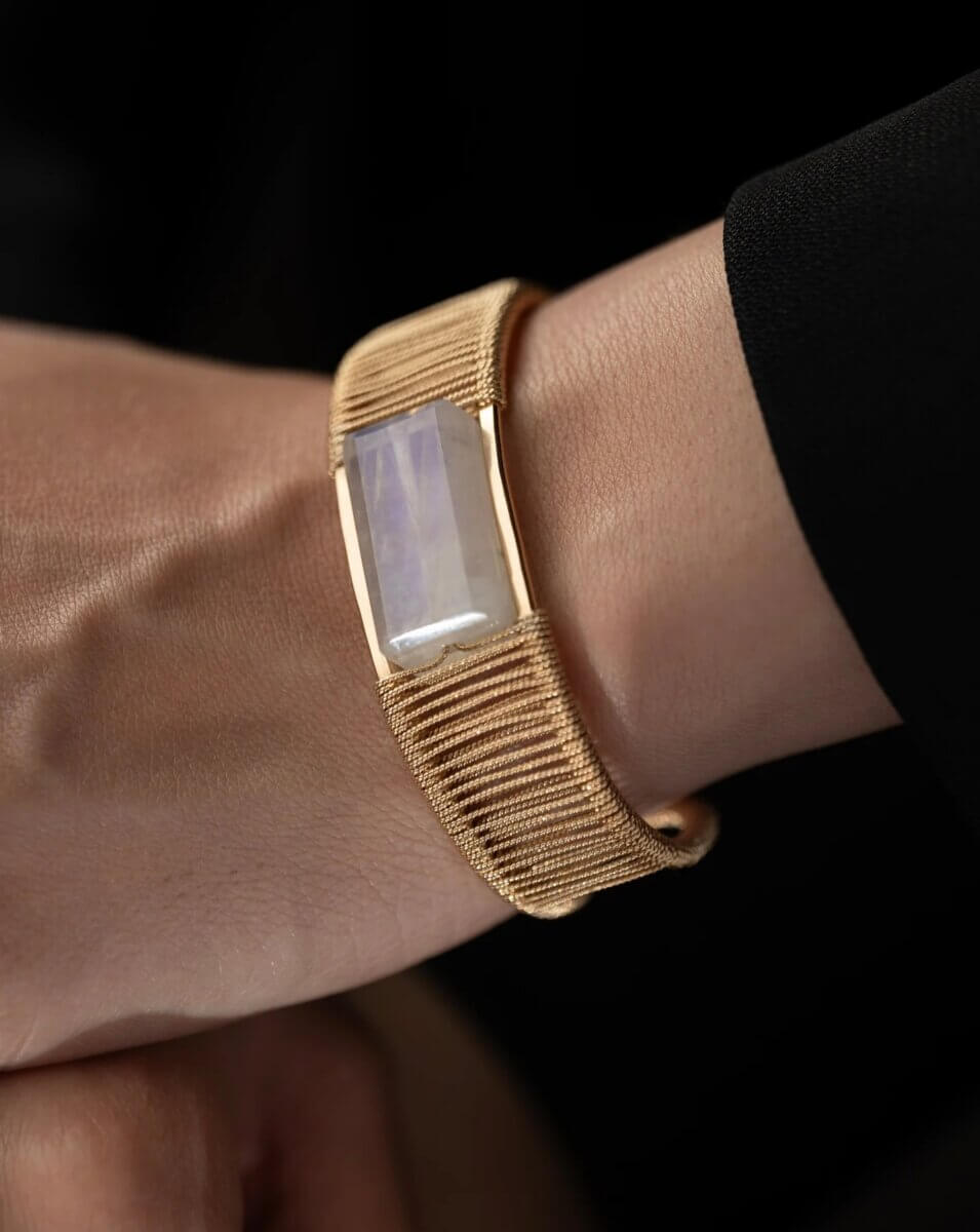 20 Spring FINDS for Mother’s Day & Beyond: Style, Beauty & Home Must-Haves - 5 A close-up of a wrist wearing a gold mesh band bracelet with a rectangular, translucent gemstone centerpiece—an elegant piece often found in curated Nashville shops.