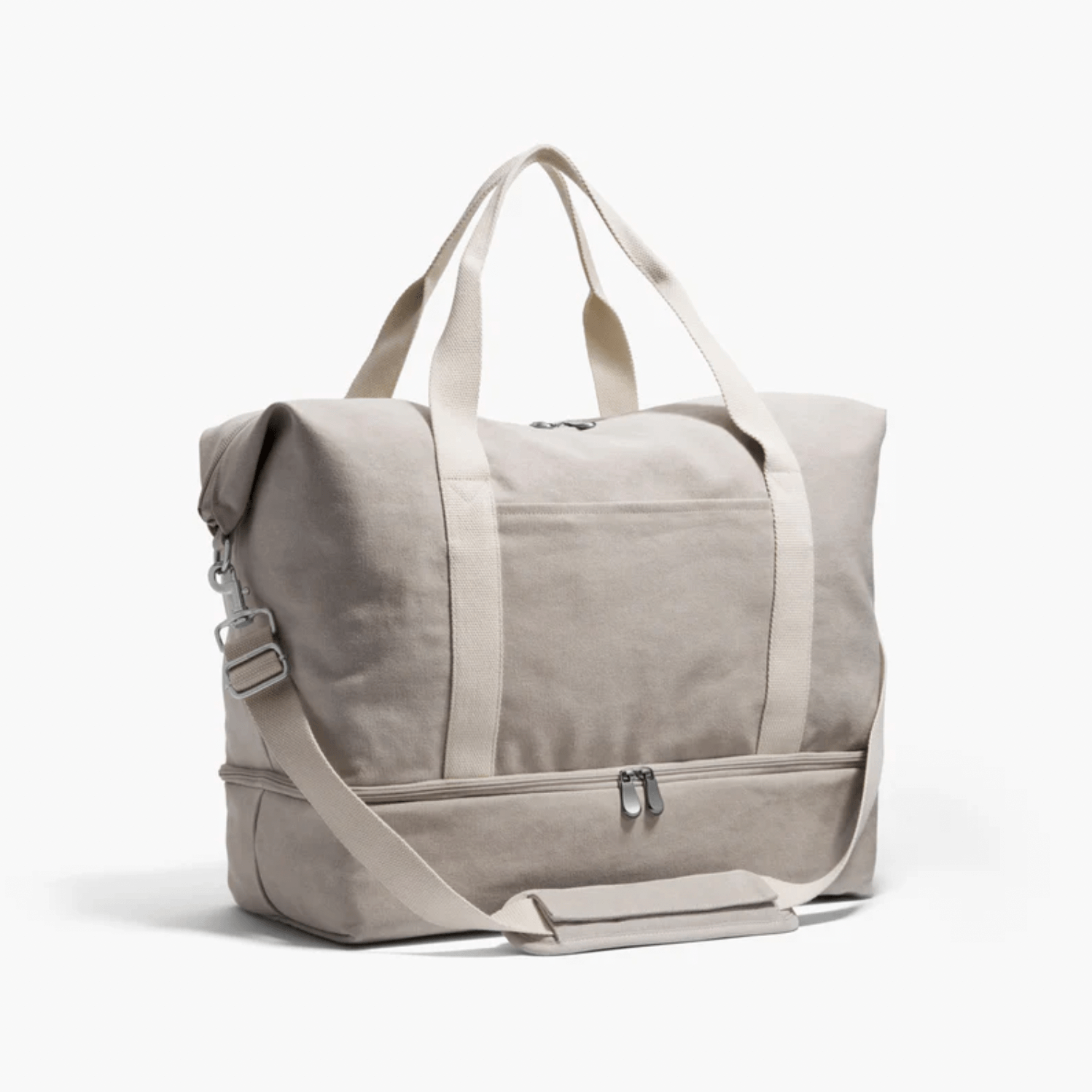 A beige canvas duffel bag with two handles, a shoulder strap, and a zippered lower compartment is displayed on a plain white background—an ideal choice for those seeking the best luggage for versatile travel.