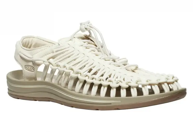 A beige, open-weave sandal with a closed heel, cushioned sole, and bungee-style lace closure—perfect for Dad’s summer vacation or as a smart pick from the Father’s Day Gift Guide.