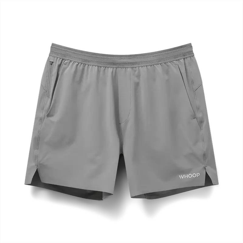 Gray athletic shorts with side pockets and "WHOOP" printed in white on the lower right leg.