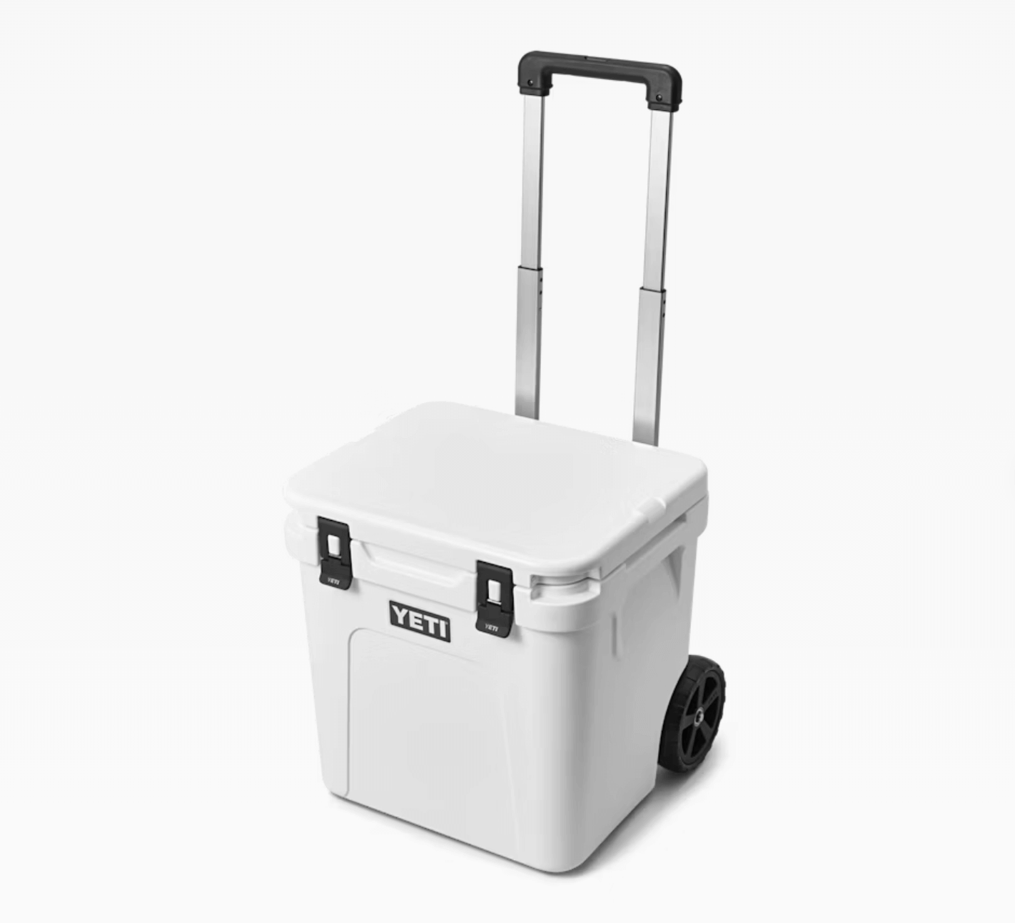 A white Yeti rolling cooler with a black handle extended and two black wheels, shown against a plain white background.