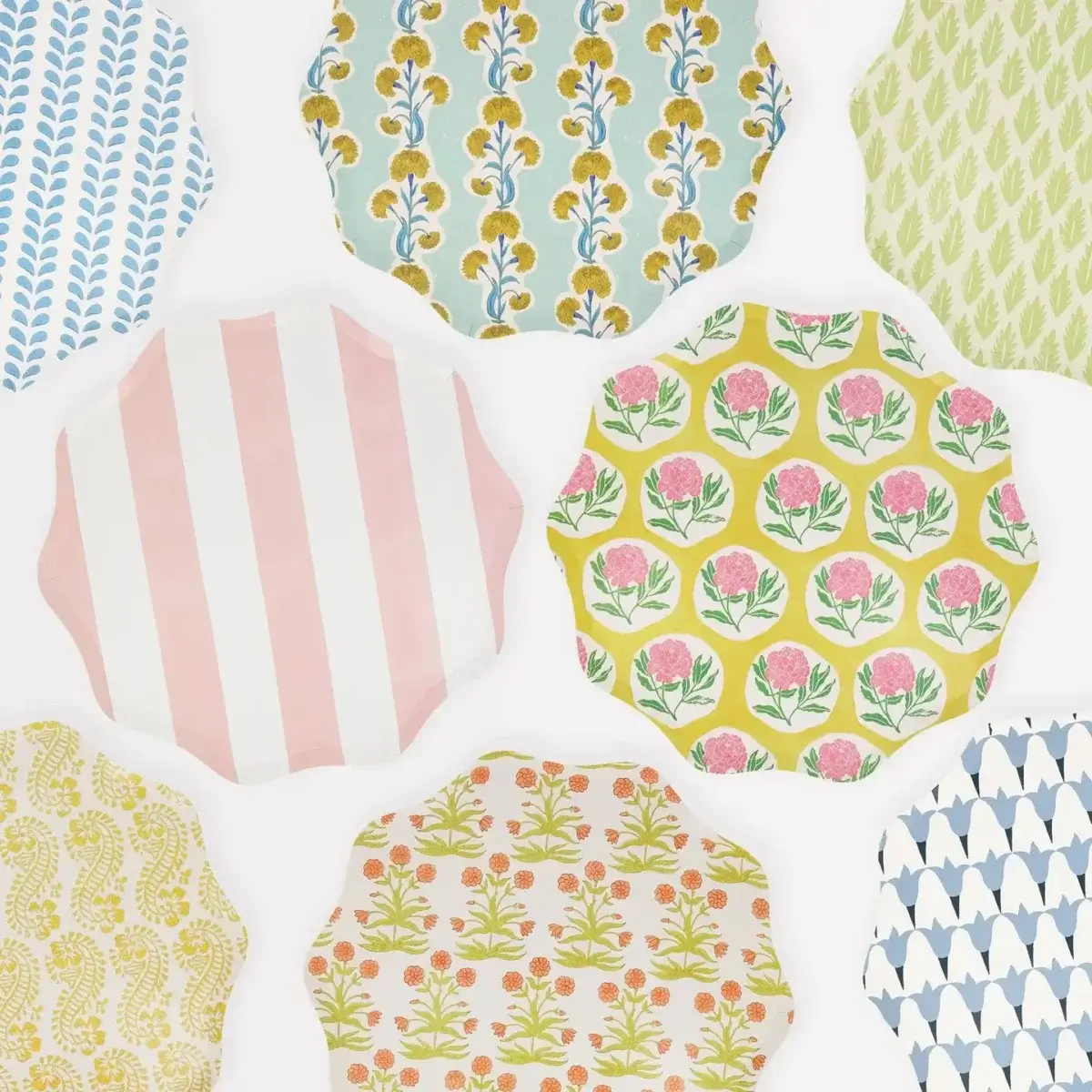 22 Birmingham FINDS for June: Breezy Dresses, Entertaining & Gifts for Dad - 12 Assorted scalloped-edge plates displayed flat, each featuring a different colorful floral or geometric pattern—perfect for brightening your summer shopping finds.