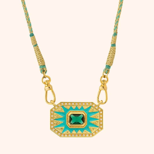 22 Birmingham FINDS for June: Breezy Dresses, Entertaining & Gifts for Dad - 9 Perfect for summer shopping, this gold necklace features a rectangular green gemstone pendant with turquoise enamel rays and sparkling white stones, all suspended from a braided turquoise and gold cord.