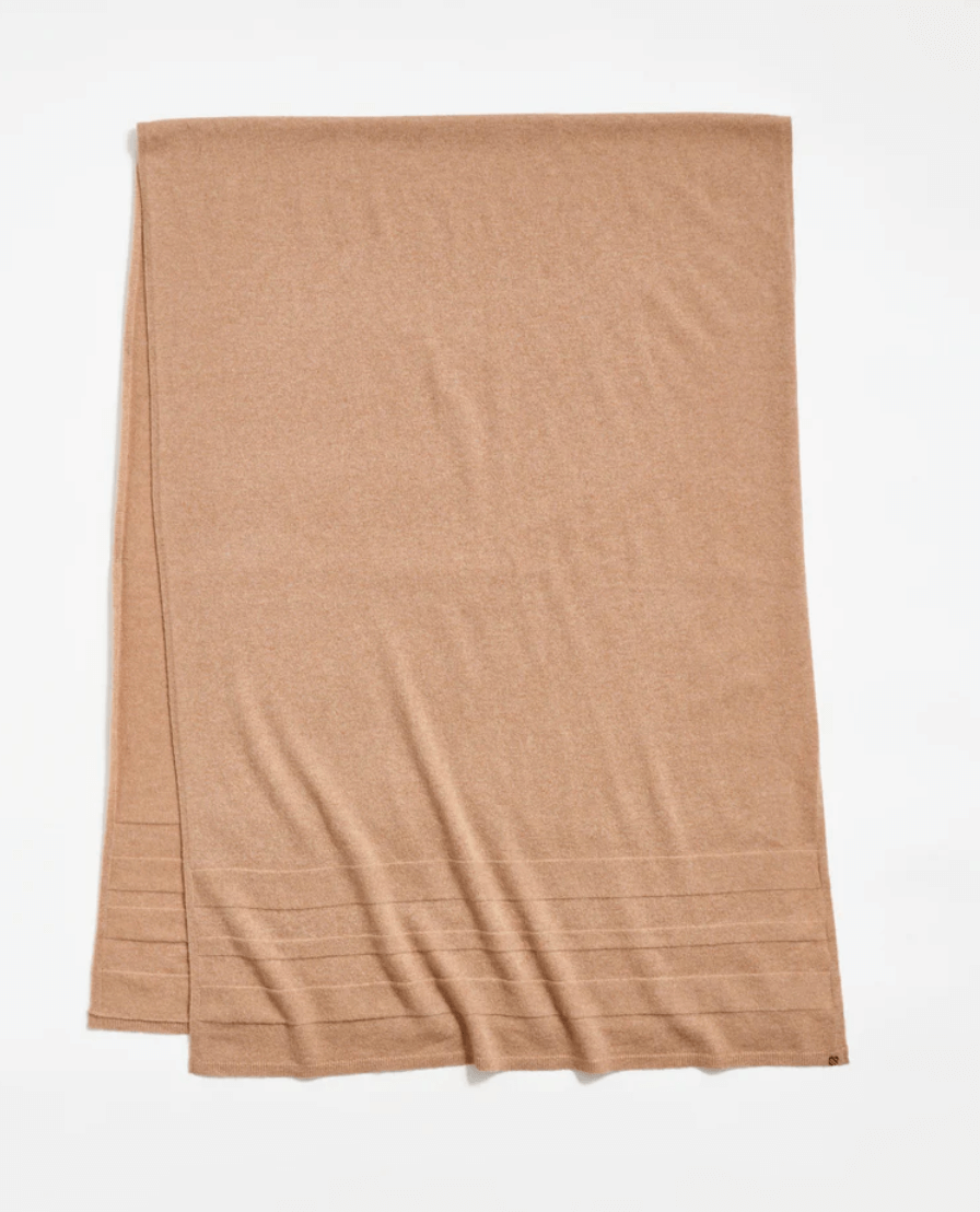 A light brown rectangular cashmere scarf laid flat on a white background, featuring subtle horizontal stitched lines at one end—a Luxe FINDS accessory perfect for elevating your Birmingham style.