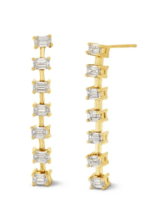 A pair of luxe gold earrings from Birmingham, each featuring a vertical row of rectangular clear gemstones set in prongs—a stunning FINDS piece.