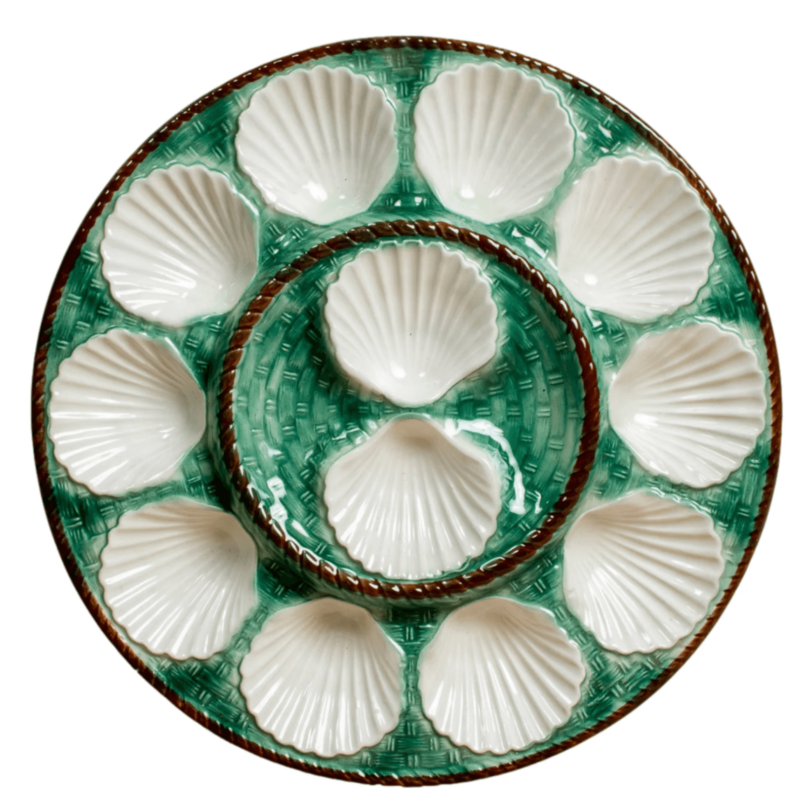 A round ceramic plate with a luxe green basket-weave pattern and twelve white shell-shaped compartments arranged in a circle—a Birmingham FINDS exclusive.