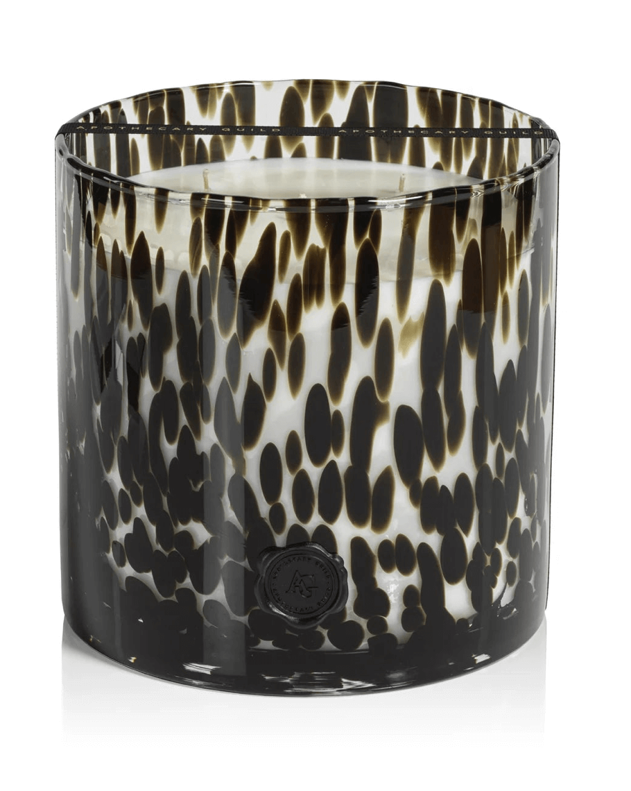 A Luxe large round glass candle holder with a black and white tortoiseshell pattern and a wax candle inside—a stylish FINDS from Birmingham.