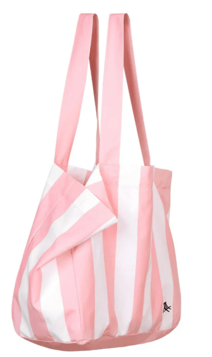 Pink and white striped tote bag with two wide handles and a small black logo near the bottom corner—a perfect June FINDS accessory in Birmingham.