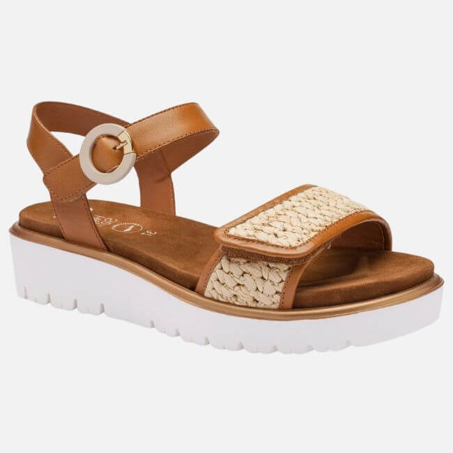 15 Memphis FINDS to Kick Off Summer: Vacation-Ready Style & More - 4 Tan sandal with a white platform sole, perfect for Memphis shopping; features a velcro toe strap with woven detailing and an ankle strap with a round buckle.